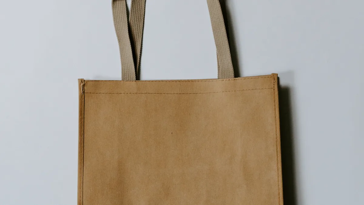 what sells on etsy: heavy canvas tote bags and illustrated cotton graphic tees on minimalist shelving